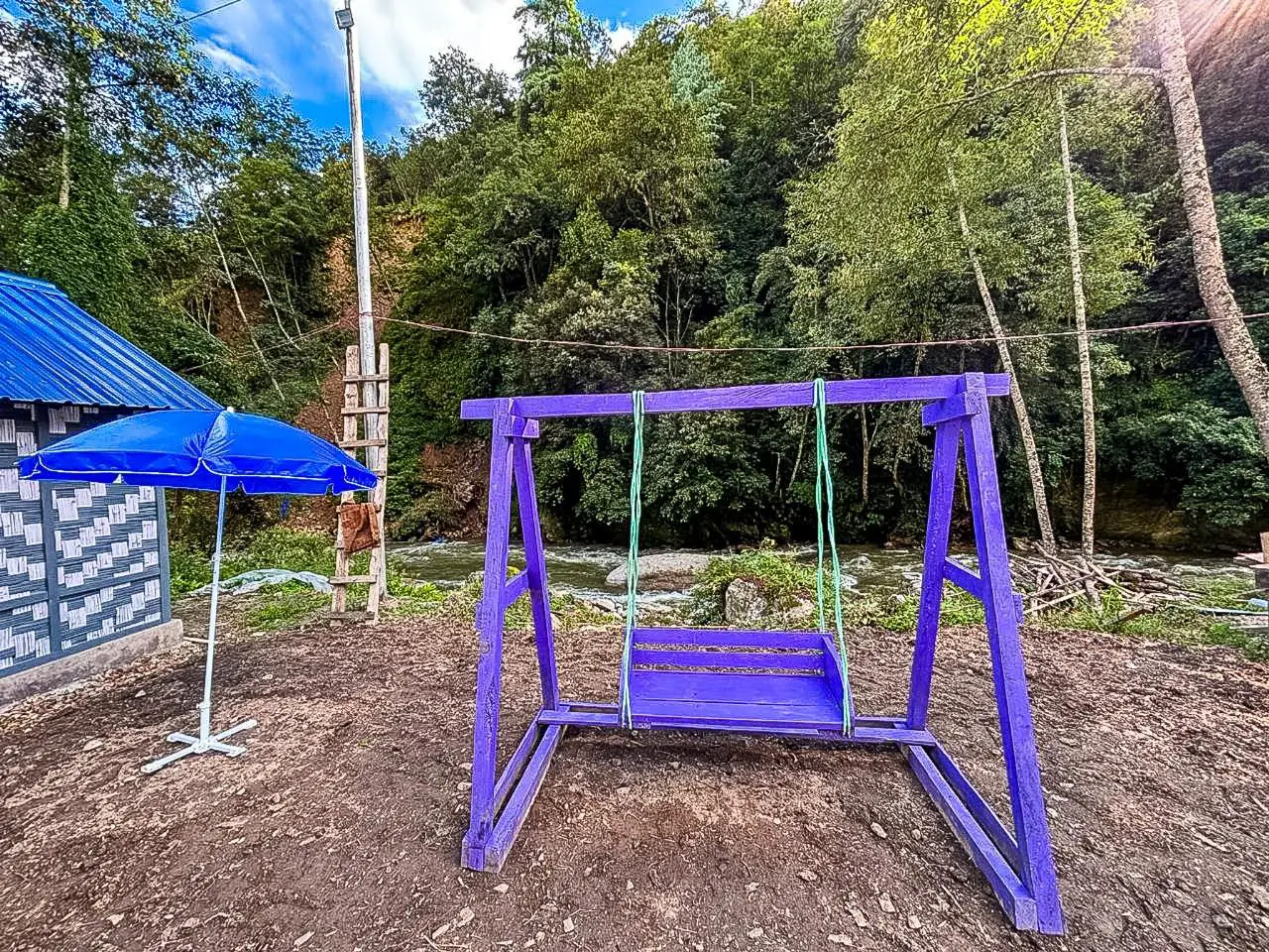 Outdoor play area with swing for children
